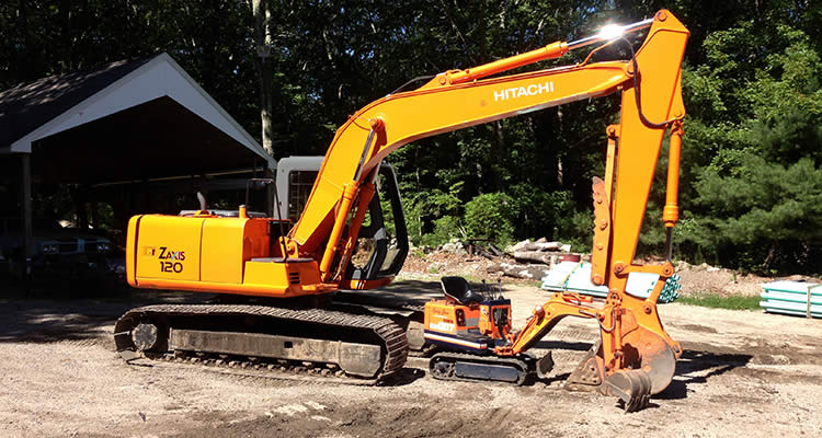 Grenco's big Hitachi backhoe and his little friend...two great pieces of equipment for septic system installations and excavations.