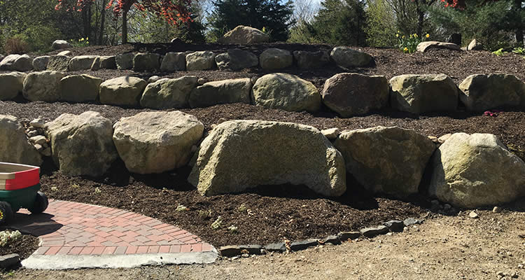 Large boulders put in plpace at a job by Grenco Septic Systems and Excavation